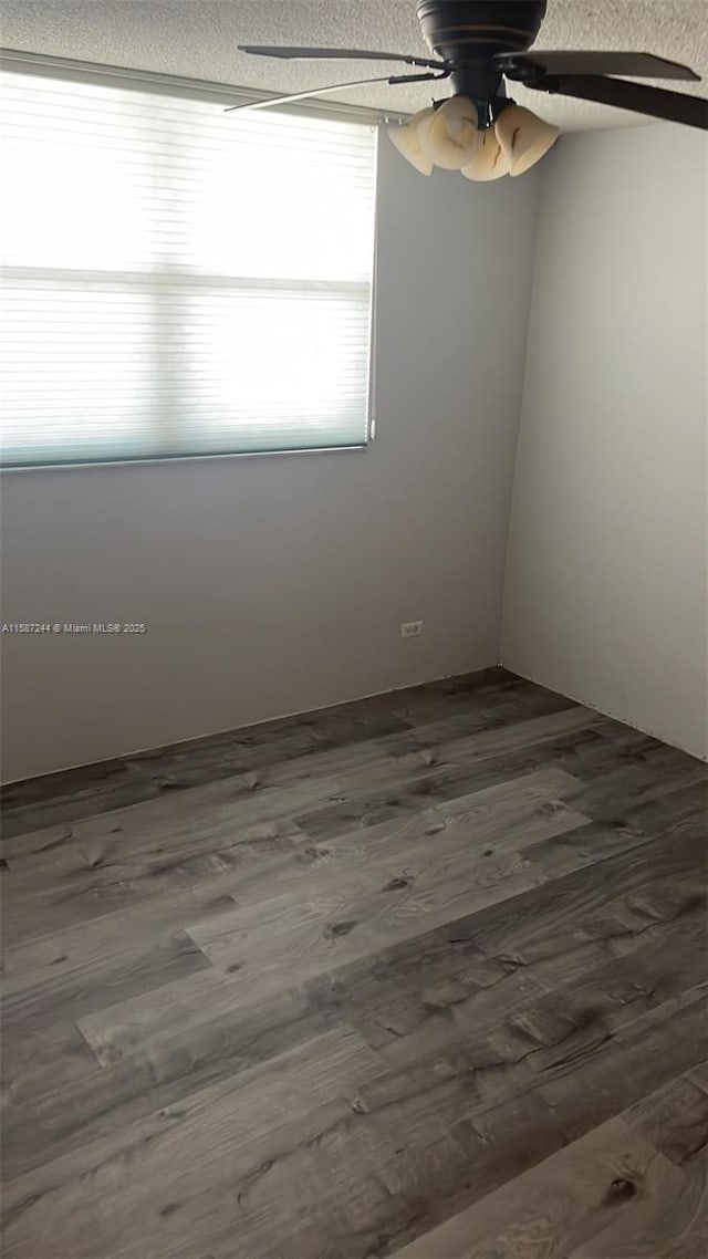 empty room with wood-type flooring, a textured ceiling, and ceiling fan