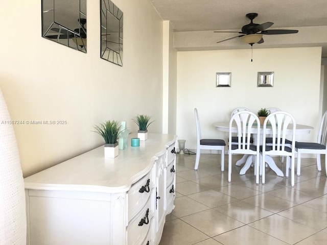 dining area featuring ceiling fan and light tile patterned flooring