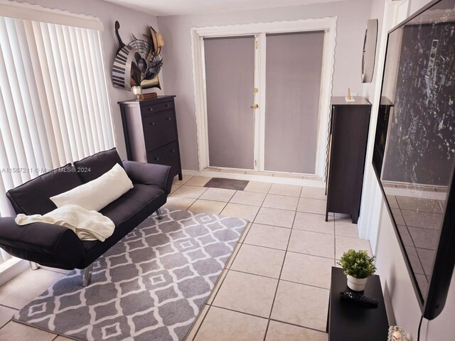 living room featuring light tile floors