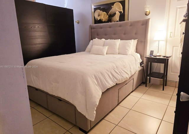 bedroom with light tile flooring