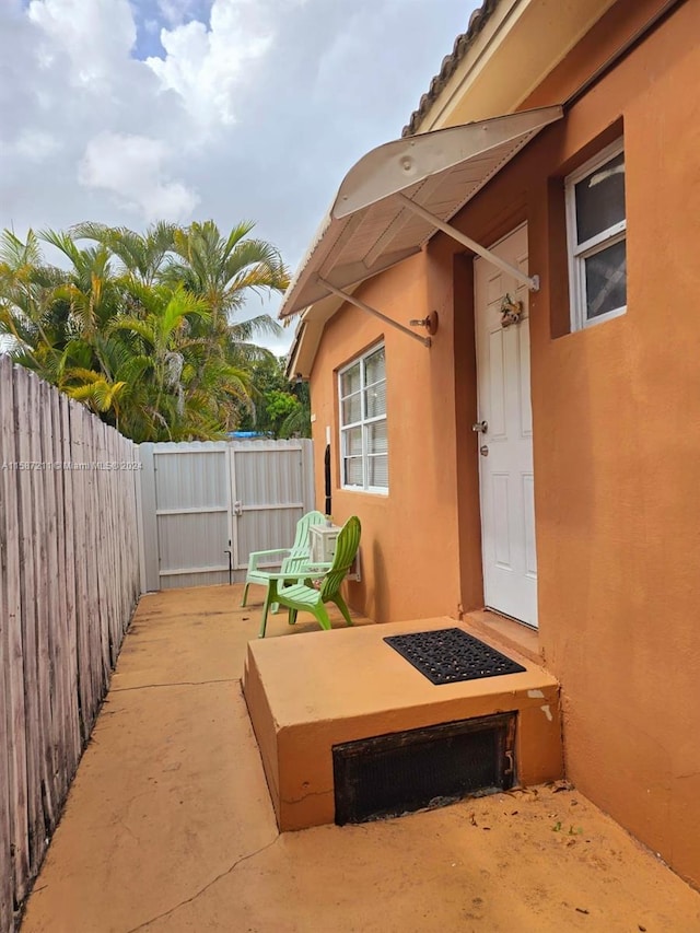 property entrance featuring a patio area