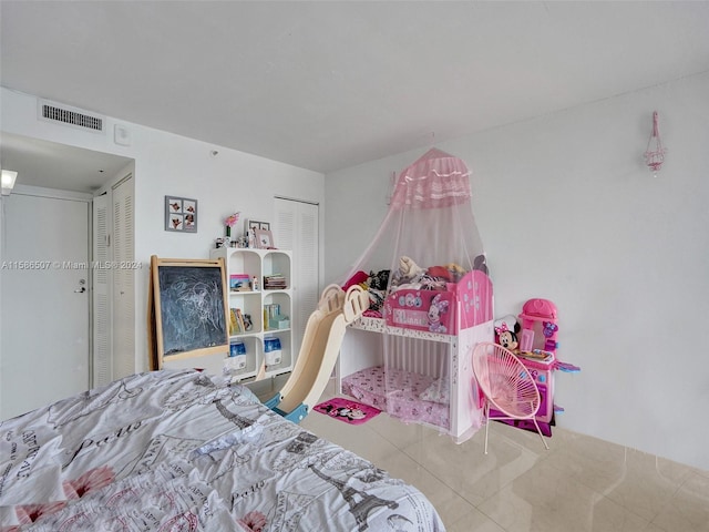 bedroom featuring light tile floors