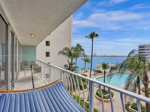 balcony featuring a water view