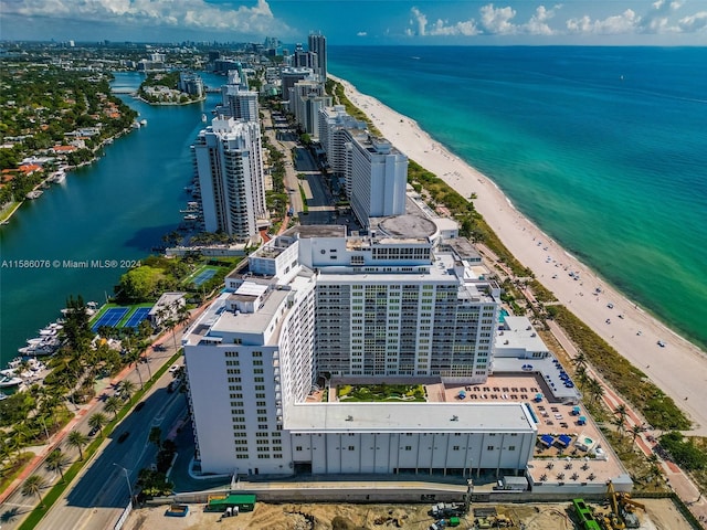 bird's eye view with a view of the beach and a water view