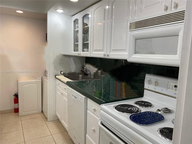 kitchen with backsplash, white cabinetry, sink, white appliances, and light tile floors