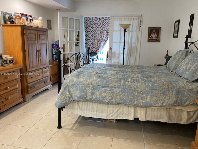 bedroom featuring light tile flooring