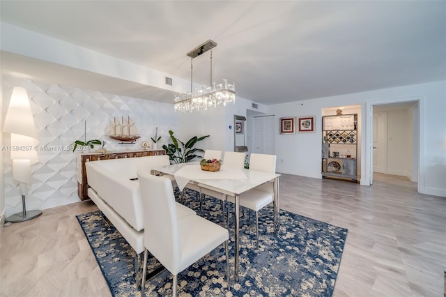 dining space with an inviting chandelier and light tile flooring