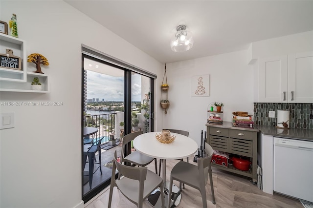 dining space featuring light parquet flooring