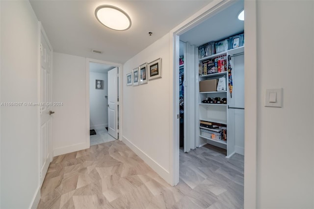 corridor featuring light tile flooring