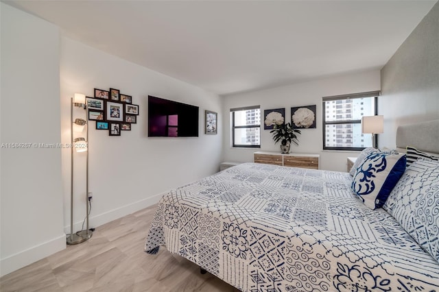 bedroom with light hardwood / wood-style flooring