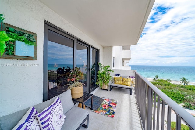 balcony featuring a water view