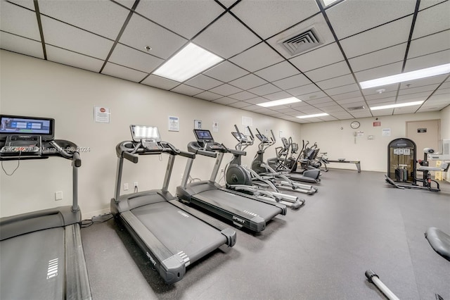 workout area featuring a paneled ceiling