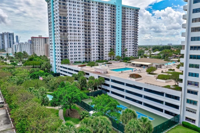 view of building exterior featuring a community pool