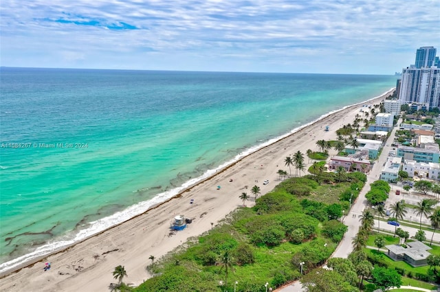 birds eye view of property featuring a view of the beach and a water view