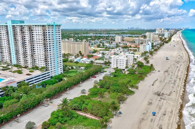 bird's eye view with a view of the beach and a water view