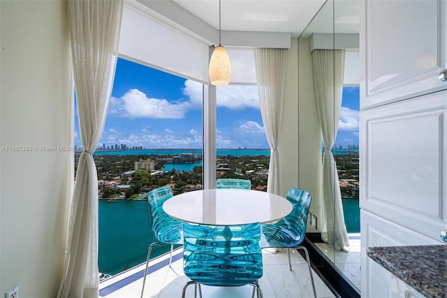 dining area featuring a water view