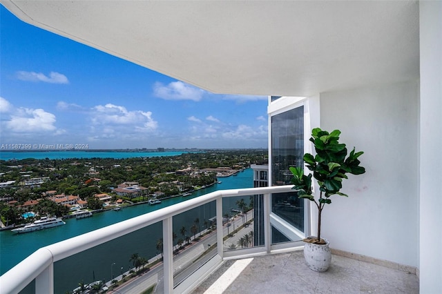 balcony featuring a water view