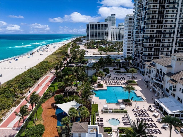 aerial view featuring a view of the beach and a water view