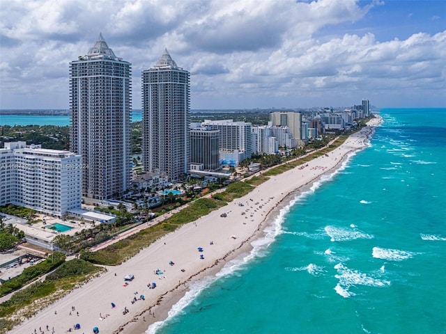 aerial view featuring a beach view and a water view