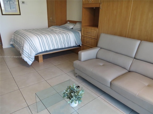 bedroom featuring light tile patterned floors