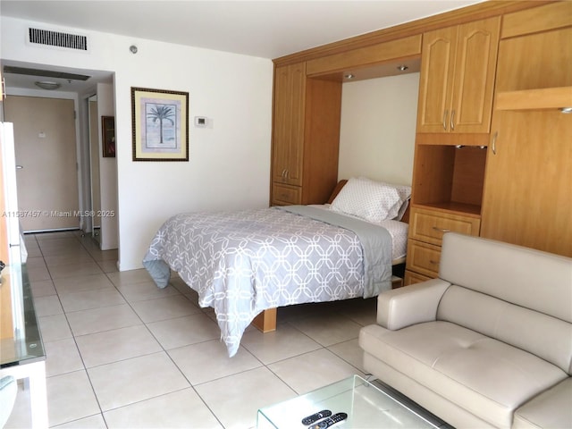 bedroom with visible vents and light tile patterned flooring