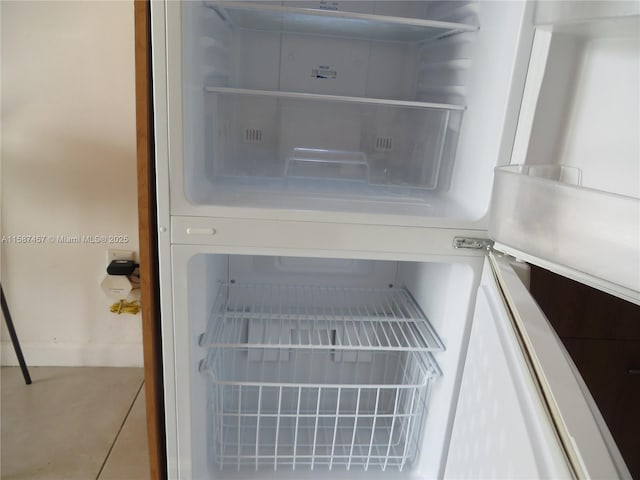 room details featuring fridge and open shelves