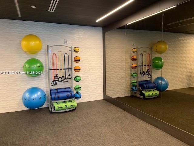workout area featuring carpet flooring