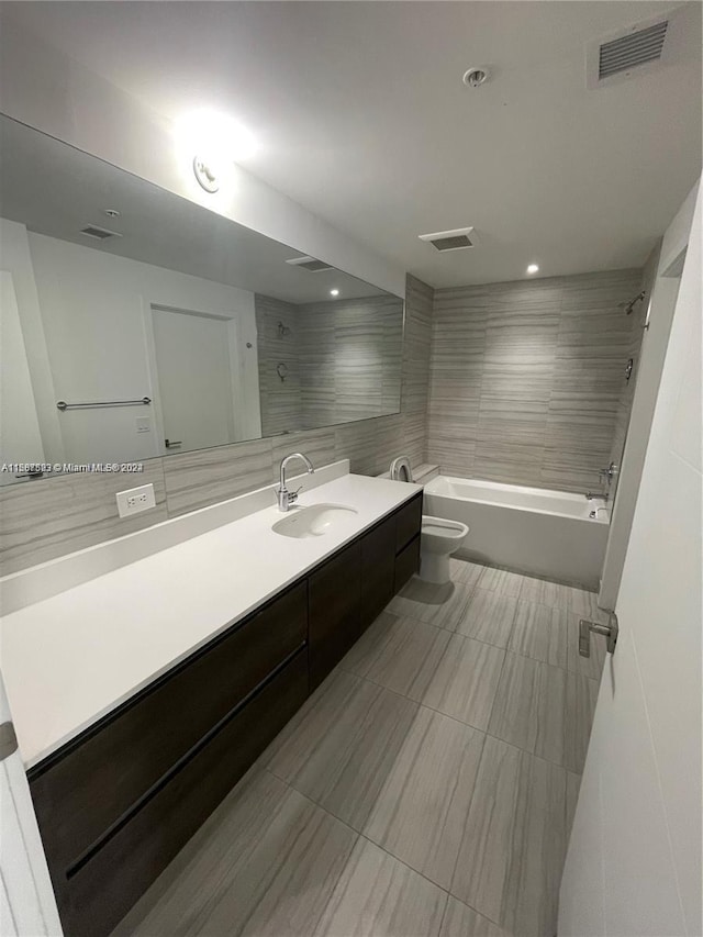 full bathroom featuring toilet, vanity, tub / shower combination, tile patterned flooring, and recessed lighting