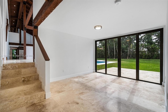 unfurnished living room with floor to ceiling windows