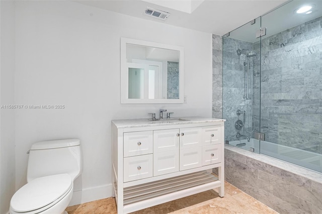 full bathroom with enclosed tub / shower combo, vanity, and toilet