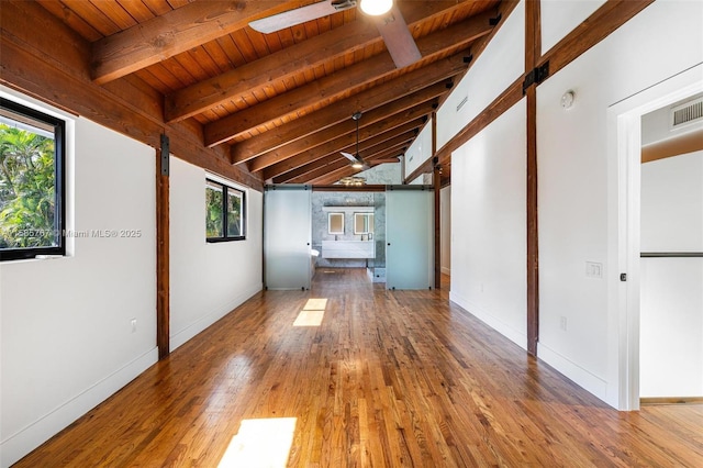 empty room featuring wood ceiling, ceiling fan, wood-type flooring, and lofted ceiling with beams