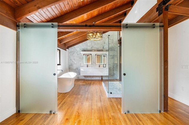 bathroom featuring hardwood / wood-style flooring, wood ceiling, and lofted ceiling with beams