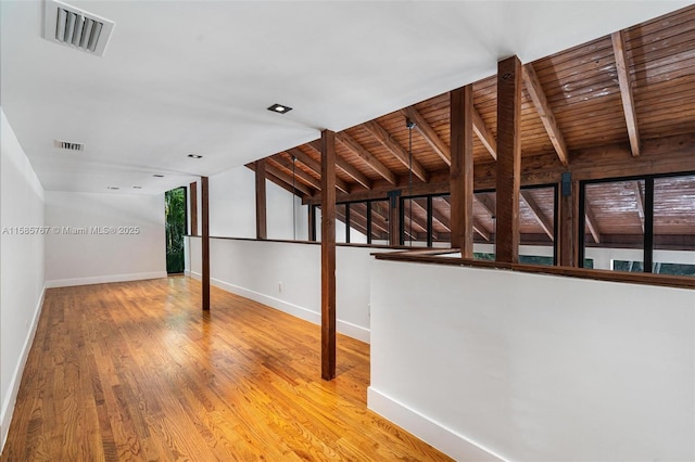 interior space with hardwood / wood-style flooring and wooden ceiling