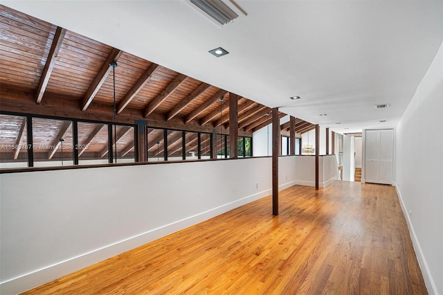 basement with hardwood / wood-style flooring and wooden ceiling