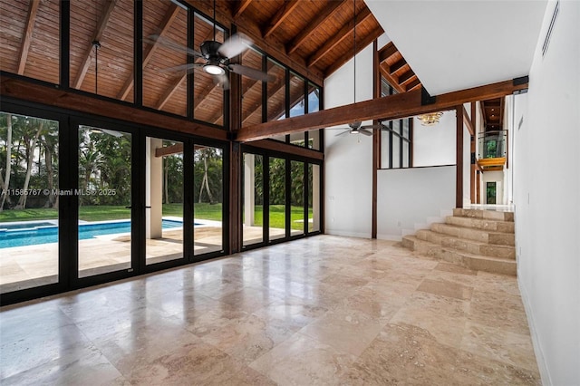 unfurnished sunroom with ceiling fan, lofted ceiling with beams, and wooden ceiling