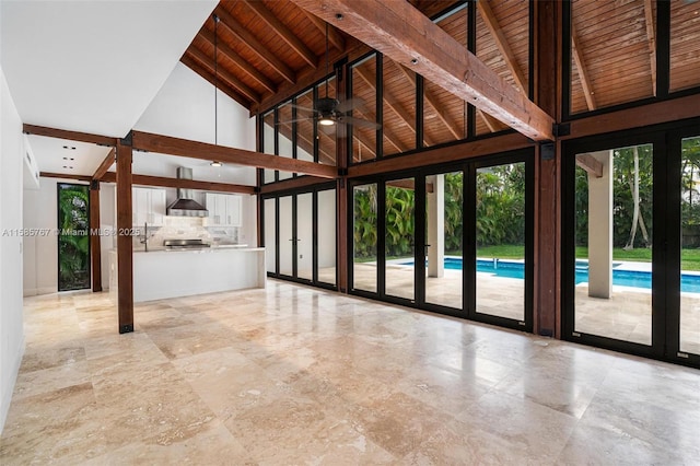 interior space featuring beam ceiling, wood ceiling, and high vaulted ceiling