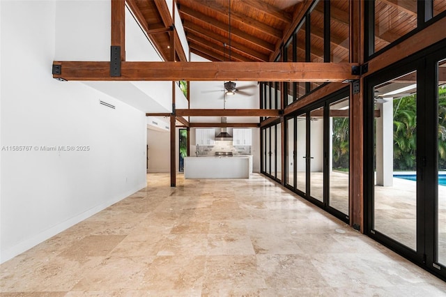 interior space featuring beam ceiling, high vaulted ceiling, and wood ceiling