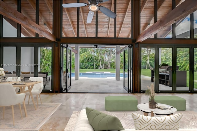 sunroom / solarium with wood ceiling, ceiling fan, lofted ceiling with beams, and french doors