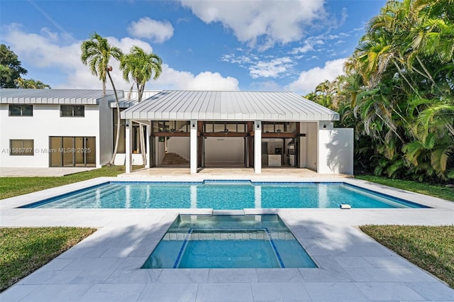 view of pool featuring a patio area, an outdoor bar, and ceiling fan