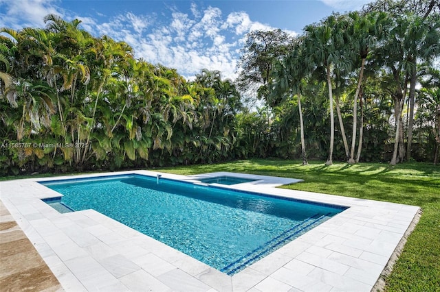 view of swimming pool with a yard and a patio area