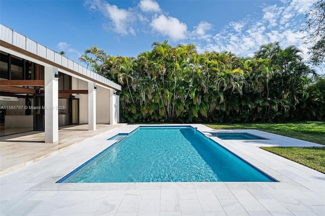 view of swimming pool featuring a patio