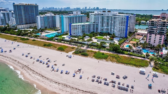 bird's eye view featuring a beach view and a water view