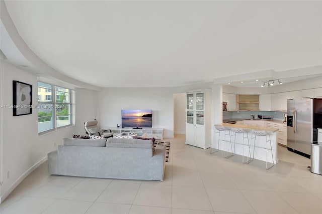 living room featuring light tile floors