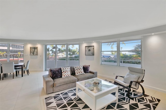 tiled living room featuring a healthy amount of sunlight