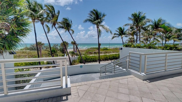 view of patio with a water view