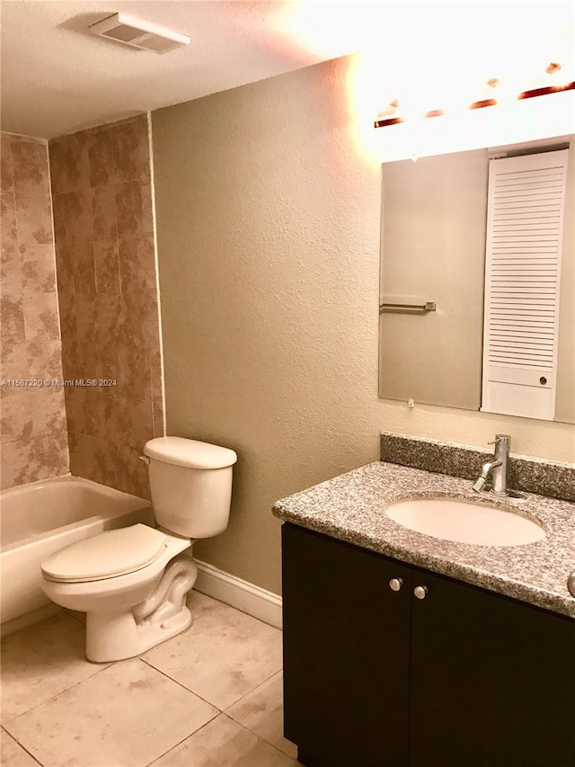 full bathroom with tile flooring, vanity, toilet, and shower / washtub combination