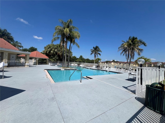 view of swimming pool with a patio