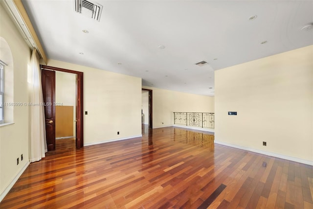 spare room with hardwood / wood-style flooring