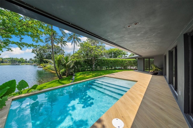 view of pool with a water view