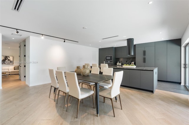 dining space featuring light hardwood / wood-style floors